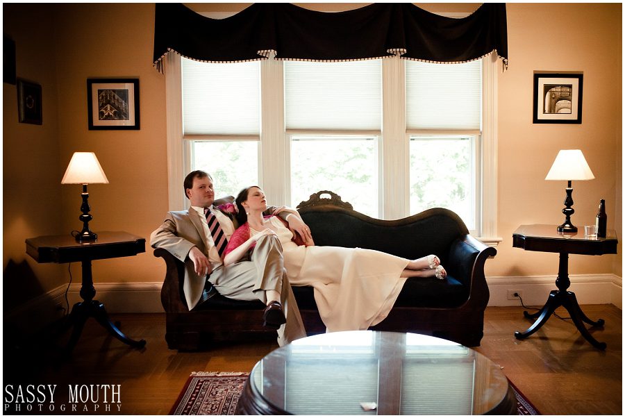 diane lounging back on robert for grooms room phot fun