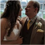 Weddings at Tarrywile heather and chris facing each other in the conservatory