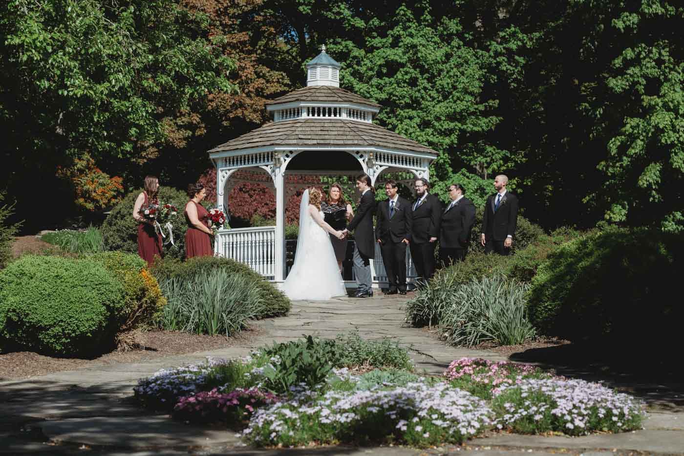 Gazebo Wedding Ceremony gazebo-wedding-couple-exchanging-vows-before-guests